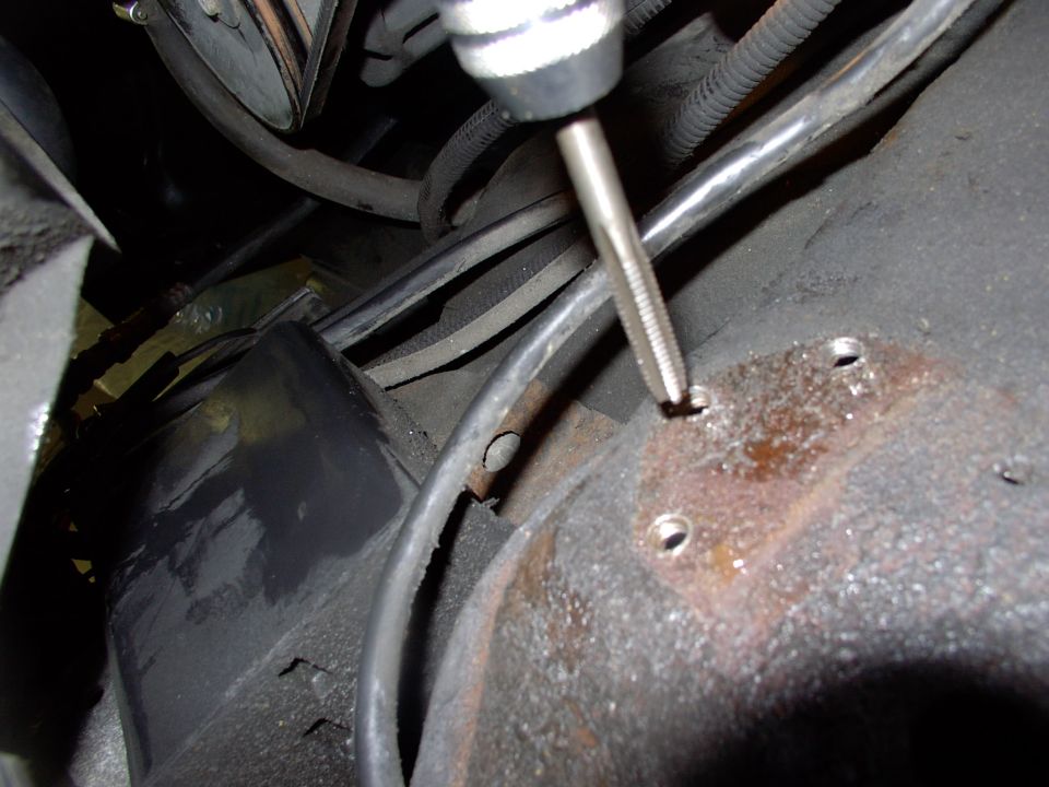 The frame rail is plenty thick enough to drill and tap it.  This works better for removal as self tapping screws tend to strip easily. I used a 5/16" UNC tap and three 1" bolts with lock washers.