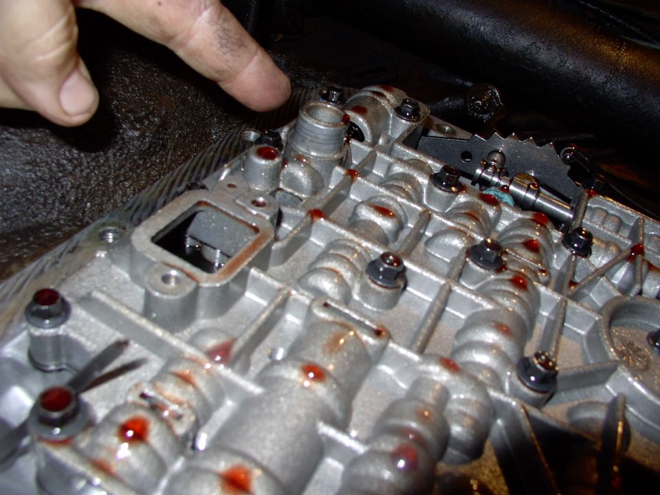 Here's the valvebody without the filter on it. Note the round snout there. That's the one people tell you to make sure only one seal goes back on as the old one often stays on the snout.