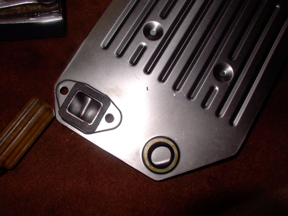 Speak of the devil, there it is.  I stick the cork gasket on with a little sealant or glue just to hold it still as you're usually twisting the filter a bit to get the round seal onto the snout.