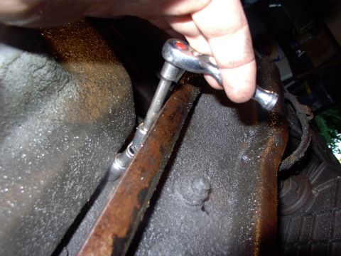 1986 Ford Bronco - These two middle rear bolts are a real treat to get to. Ford engineers should get a sound beating for sticking them under the trans mount c…