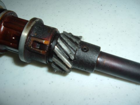 1993 Ford Taurus - A close-up view of a damaged distributor gear, showing significant wear and chipped teeth.