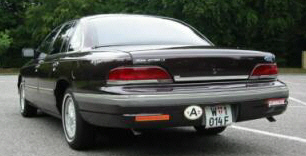 1992 Ford Crown Victoria - Rear view of a 1992 Ford Crown Victoria sedan parked outdoors.