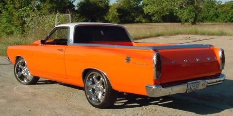 1969 Ford Ranchero - This 1969 Ford Ranchero is bright orange with a white roof and custom chrome wheels.