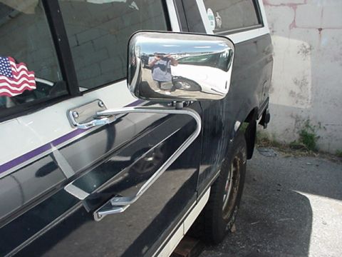 1989 Ford Bronco - Close-up of the side mirror and door panel on a 1989 Ford Bronco.
