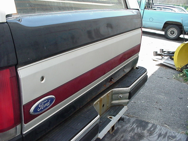 Rear of a 1989 Ford Bronco with a Ford badge and two-tone paint