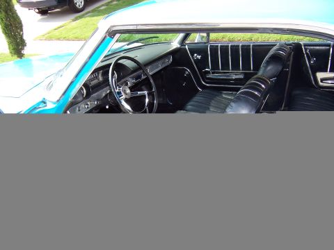 1963 Ford Galaxie - Interior view of a classic car, showing the dashboard, steering wheel, and seats.