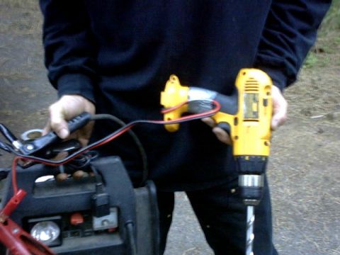 1995 Ford Bronco - First trail fix. Installing tow points My DeWalt battery dies so we hooked up an auto battery charger to the leads. Worked like a charm.....