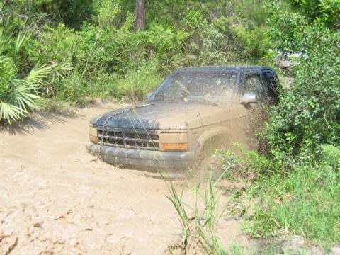 1992 Ford Bronco - Pickup truck stuck in mud during an off-road excursion.