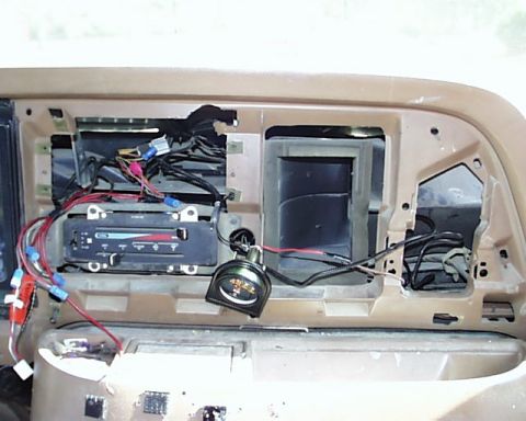 1988 Ford E250 - The dashboard is disassembled, revealing the internal wiring and ventilation system.