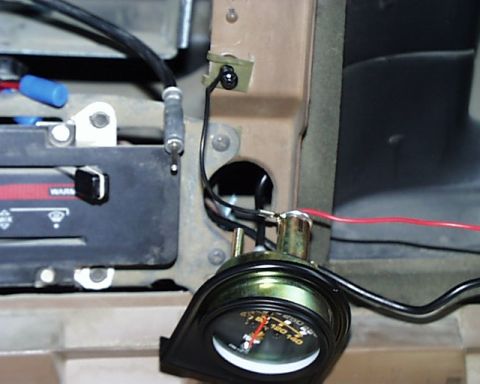 1988 Ford E250 - An aftermarket gauge is visible in the dashboard of a 1988 Ford E250, next to the stereo unit.