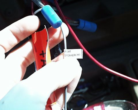 1988 Ford E250 - Close-up of car stereo wiring, showing a label for the right speaker positive connection.