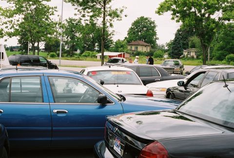 1998 Ford Crown Victoria - A lineup of police interceptor sedans, likely from the late 1990s, are parked closely together in a lot.