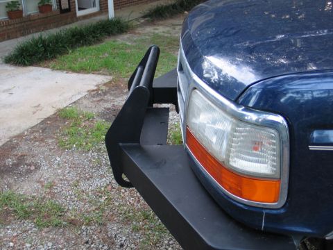 1995 Ford Bronco - Front view of a 1995 Ford Bronco showing the headlight and brush guard.