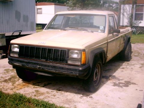 1980 Ford Bronco - This Jeep Comanche pickup truck appears to be from the late 1980s, not a 1980 Ford Bronco.