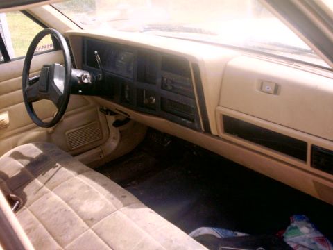 1980 Ford Bronco - Interior view of a car's dashboard and seat, with the "SUPERMOTORS" logo visible in the lower right corner.