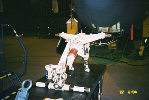 1988 Ford Bronco - Close-up of an aircraft landing gear assembly, likely in a maintenance or storage area.