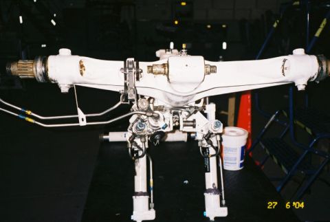 1988 Ford Bronco - A close-up view of a complex aircraft landing gear strut assembly, likely undergoing maintenance or repair.