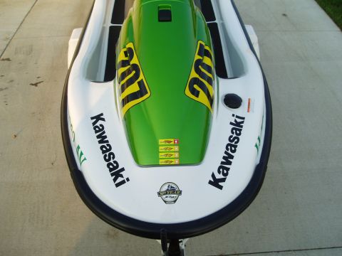 1987 Ford Bronco - Kawasaki Jet Ski with 'LUX' decals on the front deck.