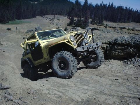 1978 Ford Bronco - This modified off-road vehicle navigates a challenging rocky trail, its capabilities.