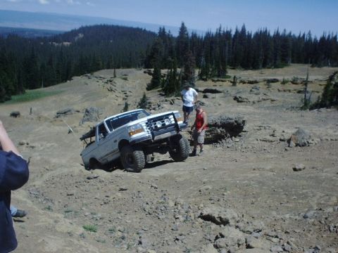 1978 Ford Bronco - This lifted Ford F-Series truck tackles a challenging off-road course, demonstrating its capabilities.