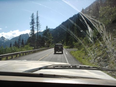 1978 Ford Bronco - Following a 1978 Ford Bronco on a winding road through a mountainous, forested landscape.