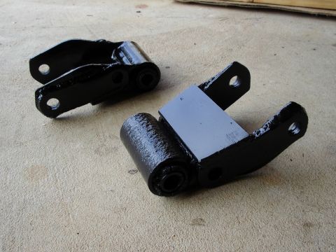 1985 Ford Bronco - Factory shackles reinforced with trailer spring shackles on the side, and plate on the back.