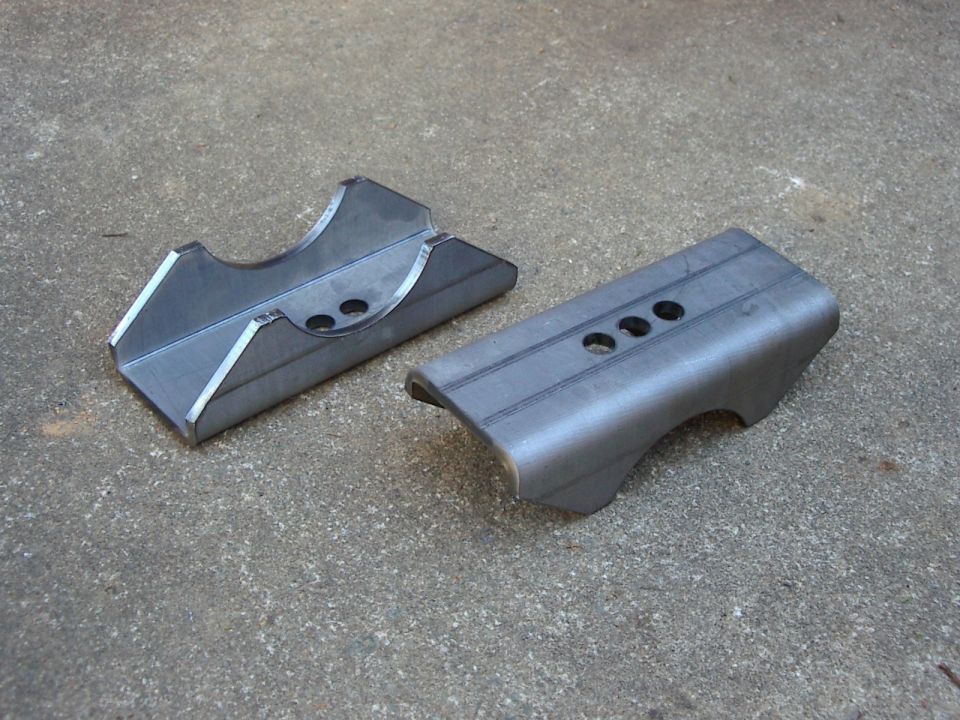 New spring perches.  Longer and wider with optional center pin holes.  Got these made at work.