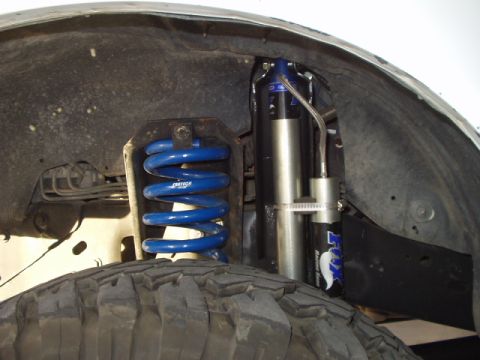 1993 Ford Bronco - Custom suspension components are visible in the wheel well of a vehicle.