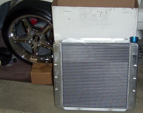 1978 Ford Mustang II - New aluminum radiator and a chrome wheel with a Cobra snake logo are shown.