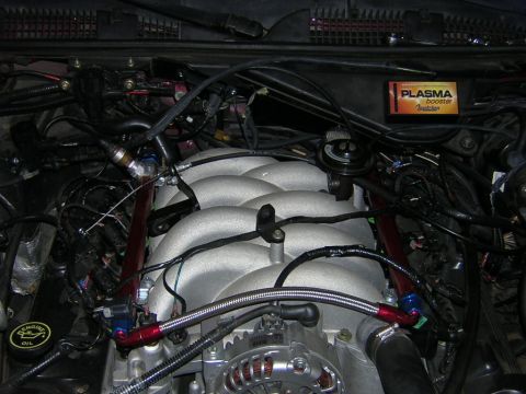 1992 Ford Crown Victoria - Close-up of an engine bay, focusing on the intake manifold and associated components.