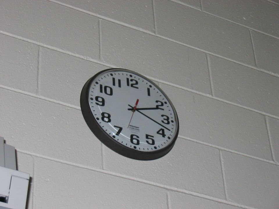 Wall clock on a brick wall