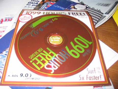1988 Ford Bronco - CD-ROM disc for AOL 9.0, offering "1099 HOURS FREE!" and "Surf up to 5x Faster!"