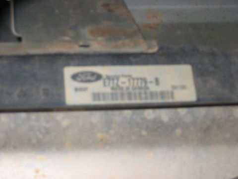 1988 Ford Bronco - A sticker on a vehicle part shows the Ford logo and part number E7TF-12A650-B.