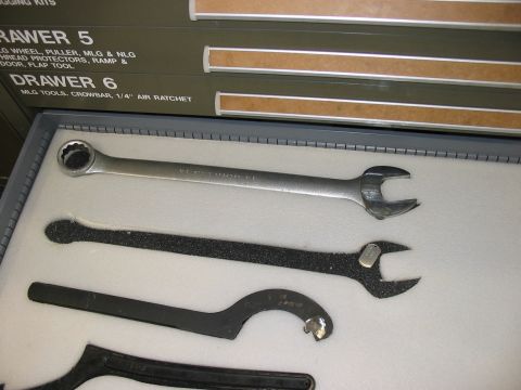 1988 Ford Bronco - A selection of wrenches and specialized tools are neatly organized in a fitted case, with drawer labels visible in the background.