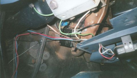 1987 Ford Bronco - Close-up view of the vehicle's interior wiring harness, showing various colored wires and electrical components.