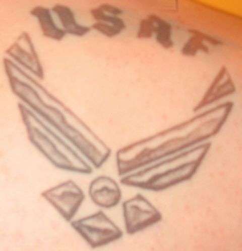 1988 Ford Bronco - A tattoo of the United States Air Force emblem is visible on skin.