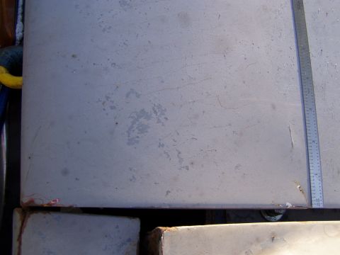 1967 Ford Bronco - A metal panel with a ruler is shown, indicating a vehicle part, but no specific year or model can be identified.