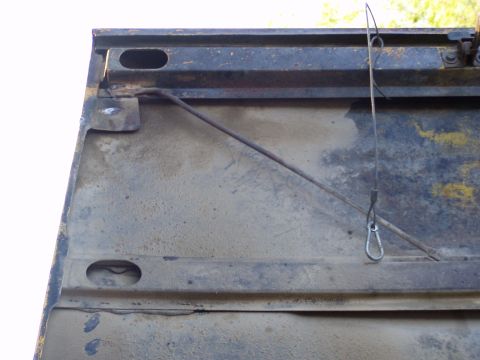 1967 Ford Bronco - Close-up view of the interior of a vehicle's tailgate, showing wear and tear.