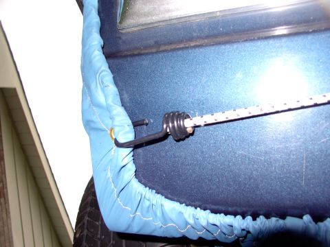 1986 Ford Bronco - The third and last bungee cord goes across the underside of the tailgate to keep the thing drawn tight to keep the West Nilers out.