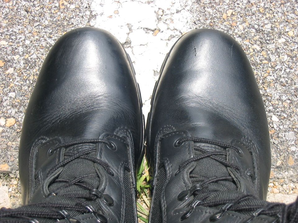 Pair of black leather boots with laces