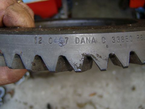 1985 Ford Bronco - Close-up of a ring gear showing DANA D 33850 part number and other stamped information.