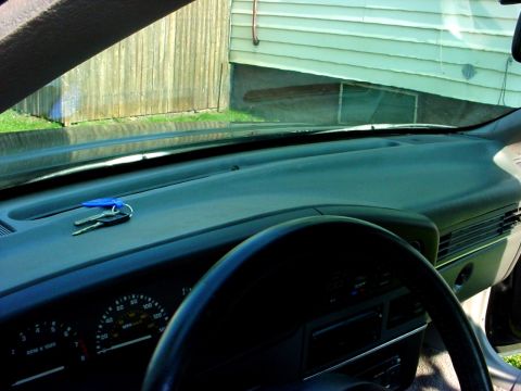 1989 Ford Taurus - Interior view of a 1989 Ford Taurus dashboard, showing the instrument cluster and keys on the passenger side.