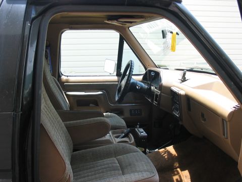 1988 Ford Bronco - Interior view of a 1988 Ford Bronco, highlighting the driver and passenger seats and dashboard.