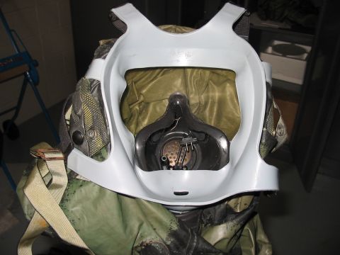 1988 Ford Bronco - Close-up of a gas mask and protective suit, likely military or industrial equipment.