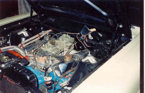 1967 Ford Fairlane - Close-up view of a modified engine bay dual carburetors and braided fuel lines.