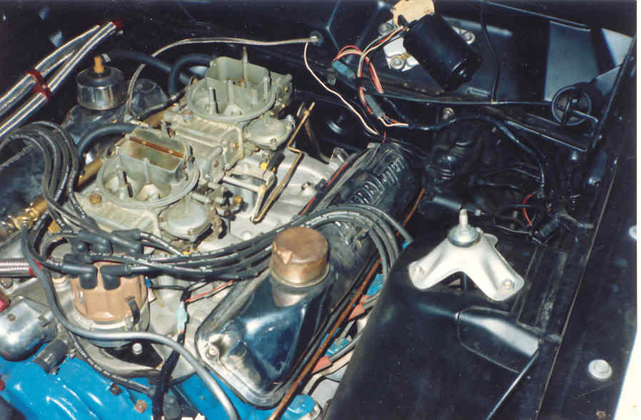 Ford V8 engine with dual four-barrel carburetors on an aluminum intake