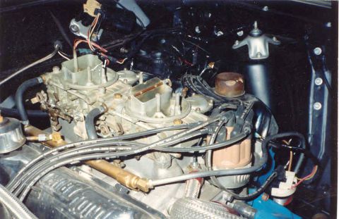 1967 Ford Fairlane - Engine bay detail a dual carburetor setup with visible spark plug wires and hoses.