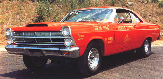Red Ford Fairlane coupe, 3/4 front view, with hood scoop and race sponsor lettering