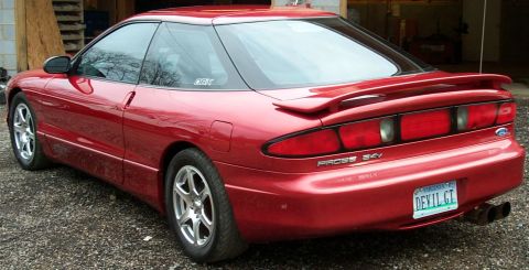 1996 Ford Probe - Rear view of a red 1996 Ford Probe, a spoiler and a custom 'DEVIL GT' license plate.