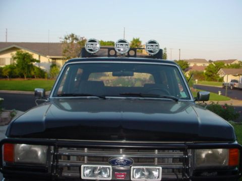 1988 Ford Bronco - This 1988 Ford Bronco features a brush guard and roof-mounted Hella lights.